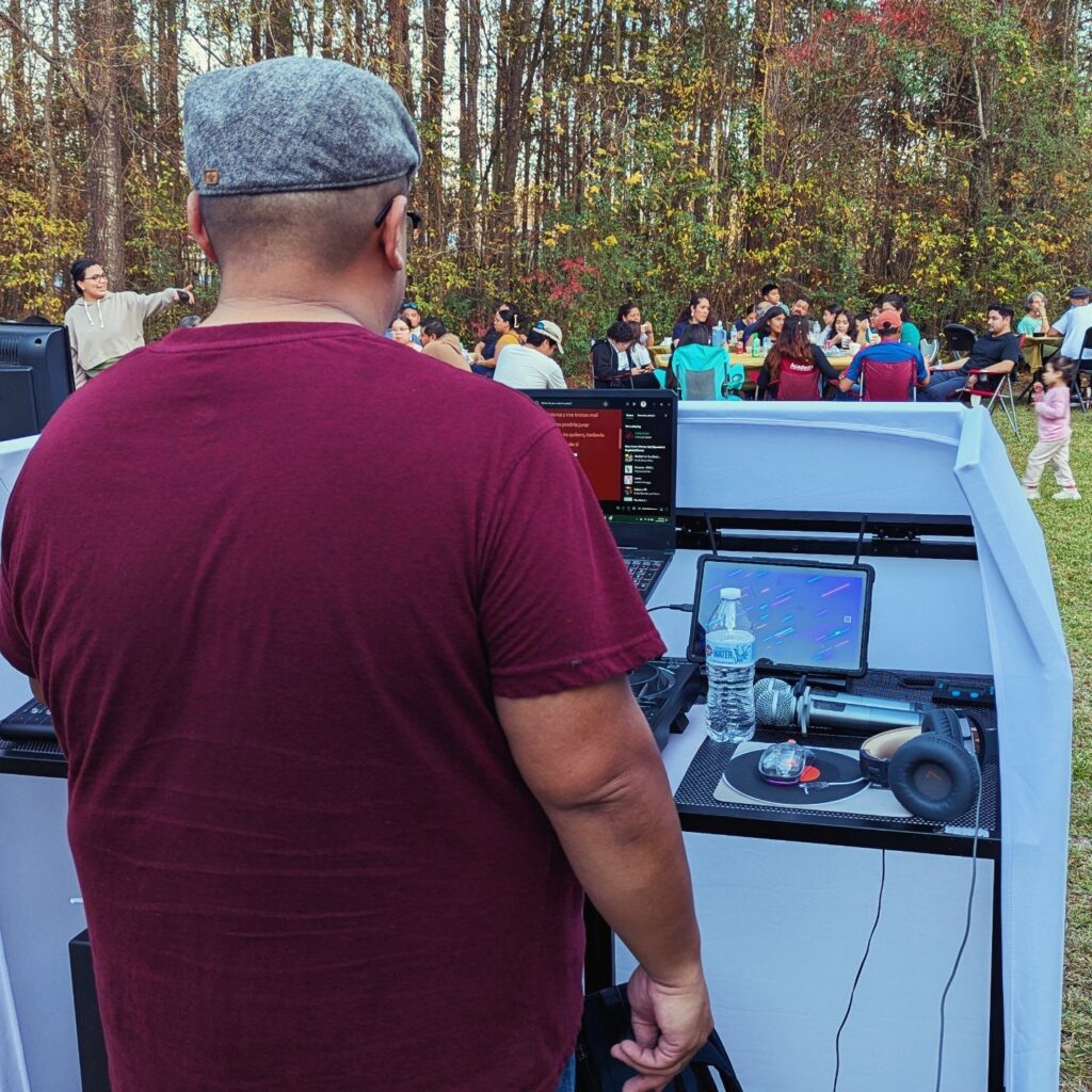 Jesse at his DJ booth at an outdoor party