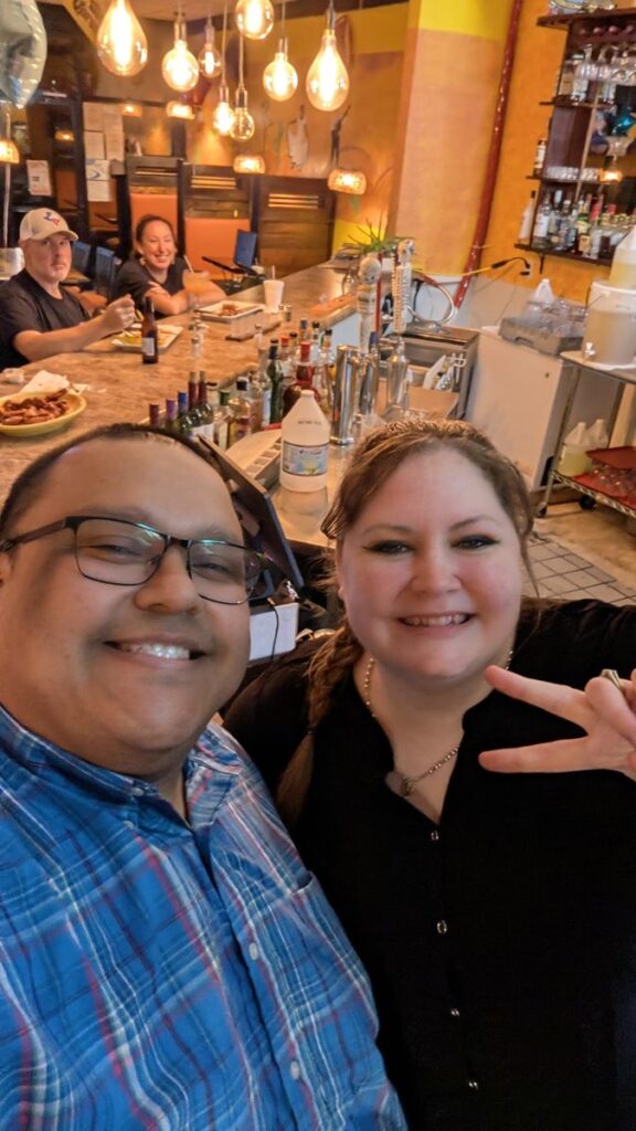 Jesse taking a selfie with a guest at an event