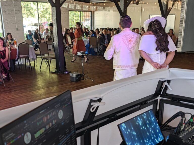 The newlyweds on the dance floor, seen from the DJ booth